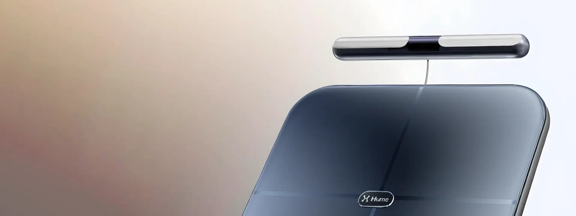 Close-up of Hume Body Pod scale with detachable handlebar sensor, showcasing sleek design for advanced body composition measurement.