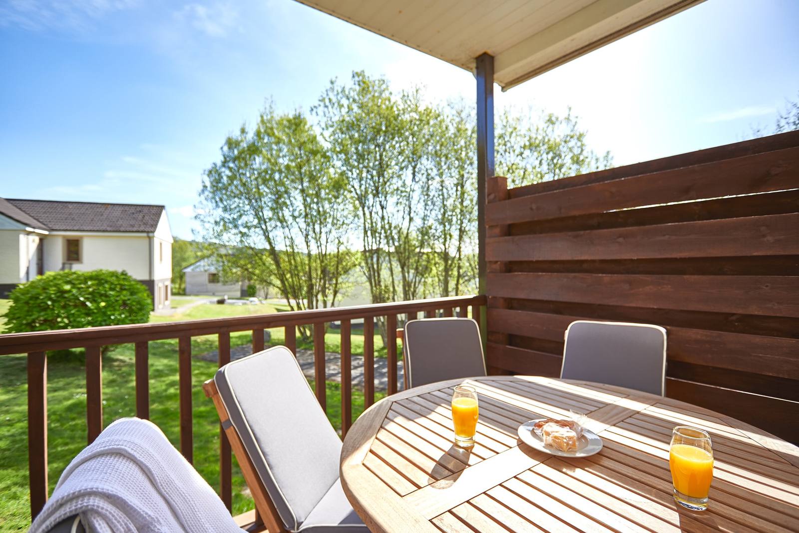 Breakfast on a lodge veranda overlooking the estate